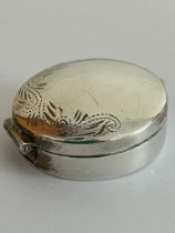 Vintage SILVER PILL BOX in circular form having scroll and foliate border. Lid opens and closes