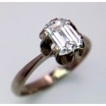 An 18K White Gold (tested) Emerald Cut Diamond Solitaire Ring. Beautiful 1ct central diamond. Size