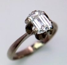 An 18K White Gold (tested) Emerald Cut Diamond Solitaire Ring. Beautiful 1ct central diamond. Size