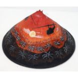 A Vietnamese Bamboo Conical Hat with a post War Hand Painted Helicopter Scene.