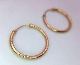 A Pair of 9K Yellow Gold Hoop Earrings. 18mm diameter. 0.76g weight.