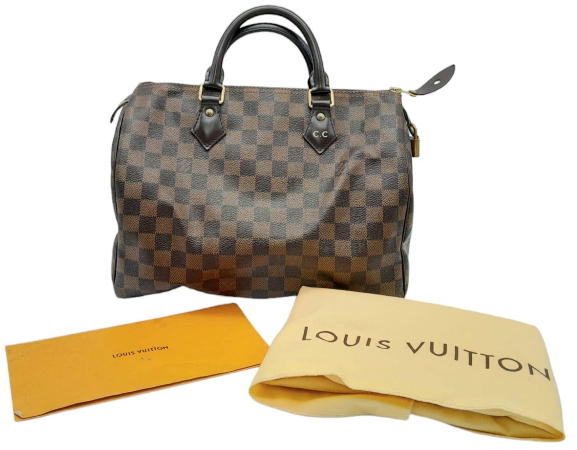 A Louis Vuitton Speedy Bag. Checked LV canvas exterior. Red textile interior. Comes with dust cover, - Image 8 of 12