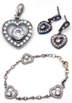 A matching set of 925 silver Zirconia jewellery include a pair of earrings, a pendant and a link