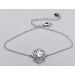 A Sterling Silver Bracelet with a stunning 1ctw Moissanite centre stone, surrounded by stones.
