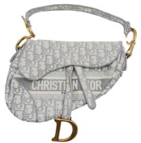 A Christian Dior Grey Saddle Bag, Gold tone hardware and Dior letter charm, comes with the