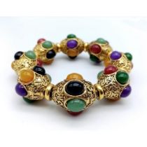 A Gilded Tibetan Style Bracelet with Multi-Colour Jade Cabochon Decoration. Gilded spacers.