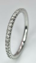 An 18K White Gold Diamond Half Eternity Ring. Size M. 1.55g total weight.