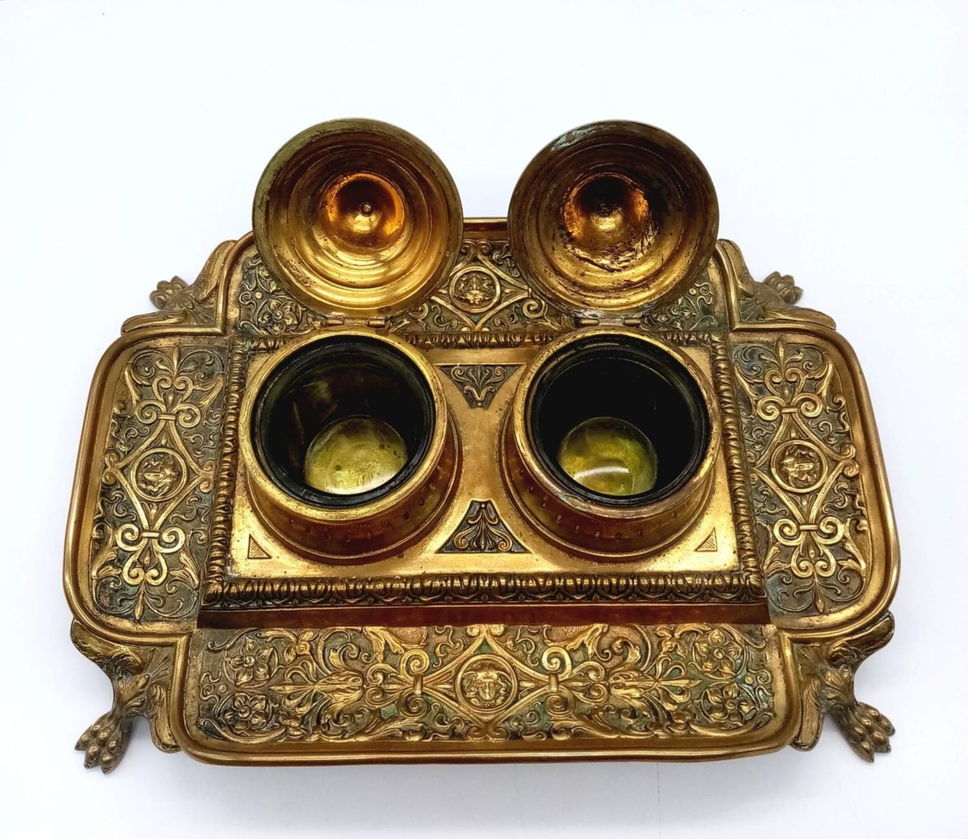 An Antique Brass (Possibly French) Double Inkwell. Ornate regal scroll decoration throughout with - Image 2 of 4
