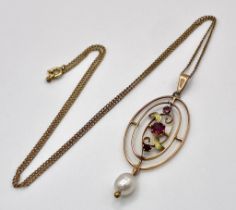 AN EDWARDIAN 9K GOLD PENDANT WITH GARNETS AND PEARLS ON A 44cms 9k GOLD CHAIN . 3.5gms