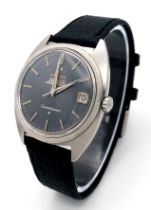 A Vintage Automatic Omega Constellation. Black leather strap. Stainless steel case - 36mm. Grey dial