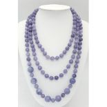 A Rope Length Graduated Lavender Jade Bead Necklace. Perfect for different wearing arrangements.