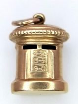 A 9K YELLOW GOLD POST BOX CHARM. 1.1G