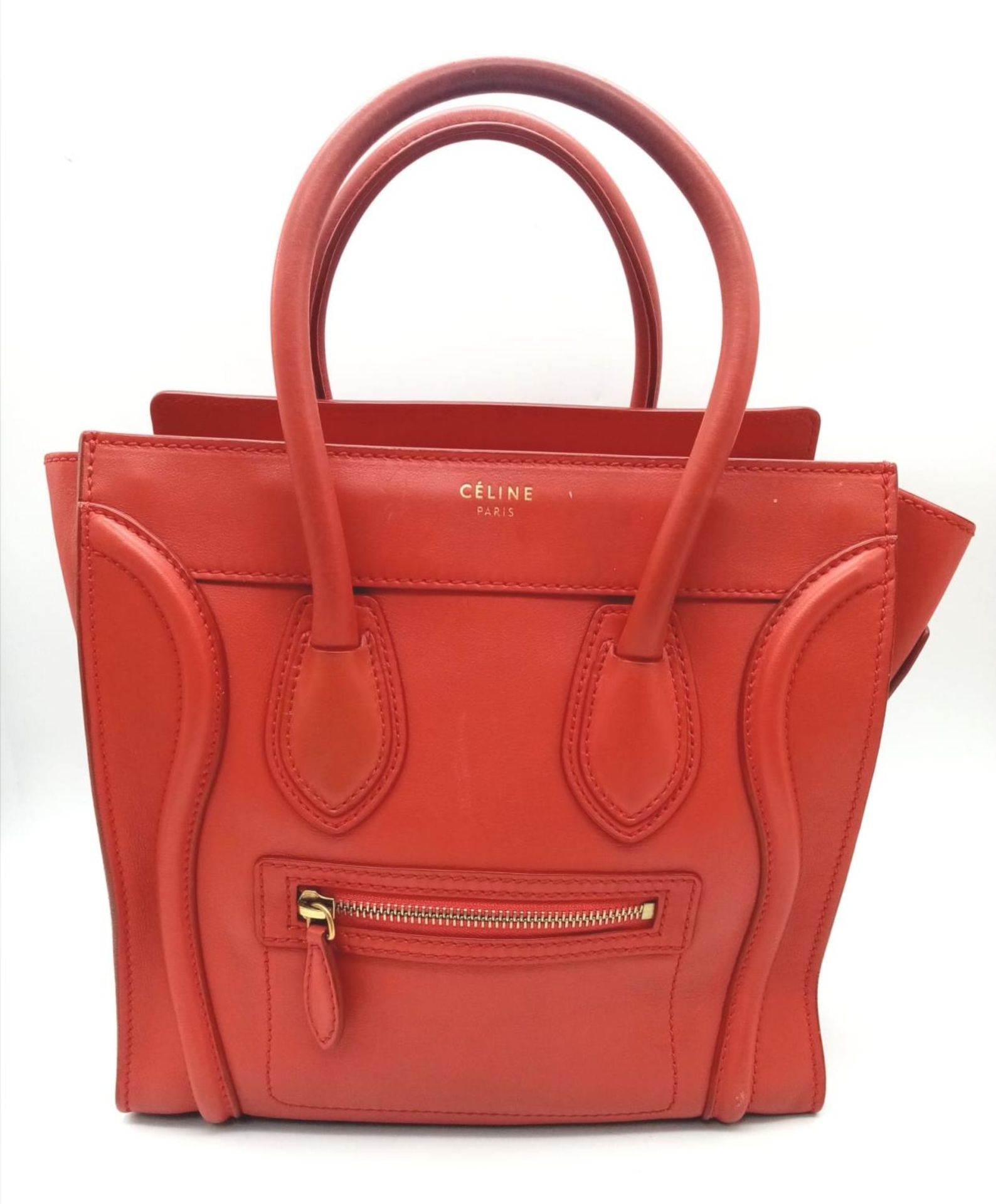 A Celine Coral Luggage Bag. Leather exterior with two rolled leather handles, a zipped pocket to the