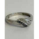 9 carat WHITE GOLD RING set with BLACK DIAMONDS and WHITE DIAMONDS. Full UK hallmark. 2.37 grams.