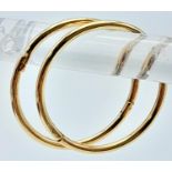 A 9K YELLOW GOLD MINI SLEEPER HOOP EARRINGS. 0.8G