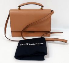 A YSL Saint Laurent Je t'aime Flap Bag. Brown leather exterior with gold-tone hardware. Adjustable