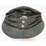 3rd Reich Waffen SS M43 Cap. very small cut on the top. A real “Been There” item.