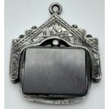 AN ANTIQUE SILVER PENDANT/FOB WITH SPINNING BLOODSTONE . 7.2gms