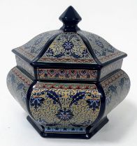 A porcelain, hexagonal lidded vase, probably of Chinese origin, exquisitely decorated on a cobalt