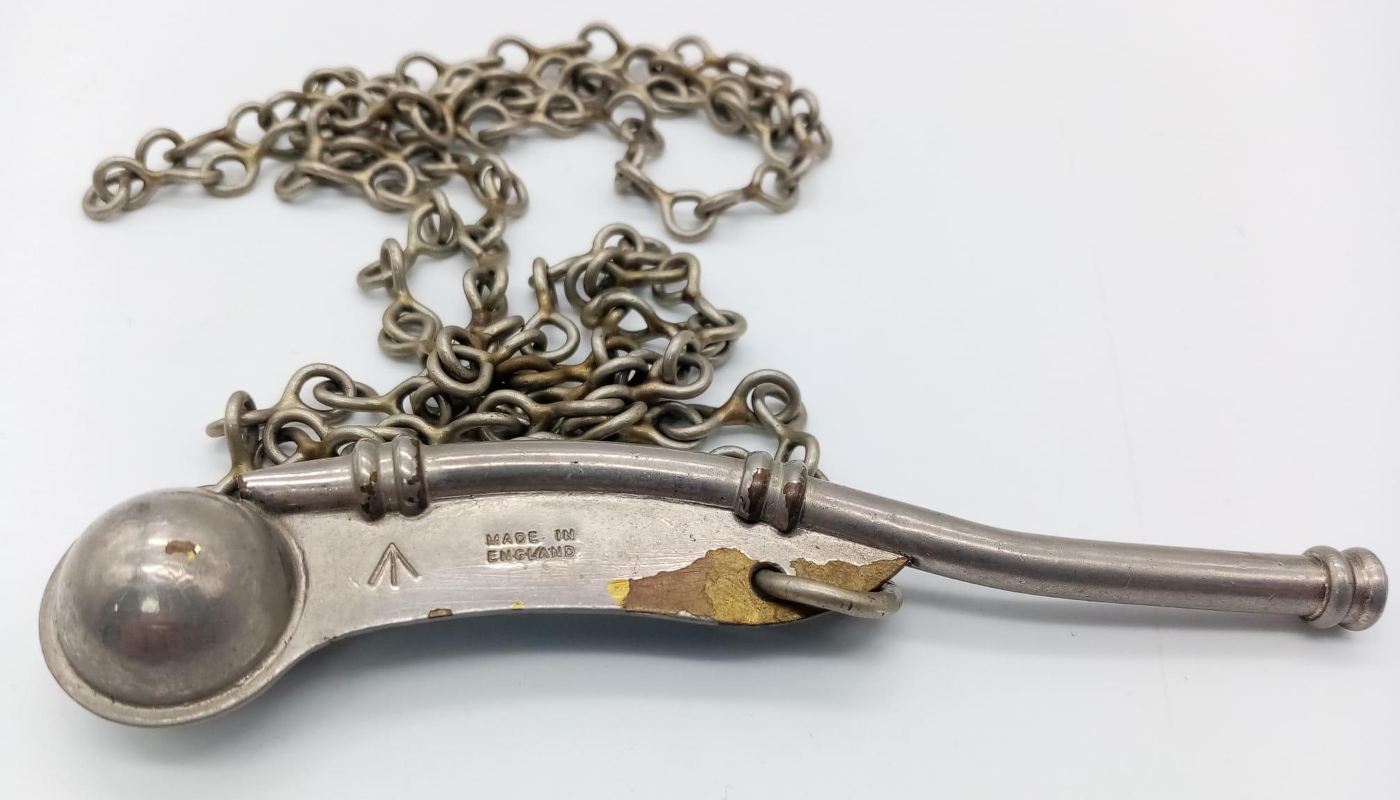 A WW2 Naval Bosuns Whistle on metal chain lanyard. Marked with a Broad Arrow. 12cm Length. - Image 2 of 4
