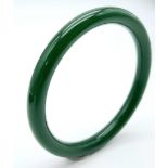 A Fashionable Dark Green Thin Jade Bangle - 6cm inner diameter. 8mm width.