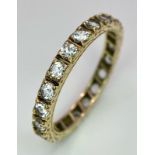 A 9k yellow gold full eternity band ring set with cubic zirconia 2.5g, size R.