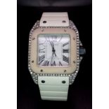 A Cartier Santos 100 Automatic Unisex Diamond Watch. White rubber Cartier strap with diamond buckle.