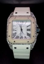 A Cartier Santos 100 Automatic Unisex Diamond Watch. White rubber Cartier strap with diamond buckle.