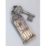 A STERLING SILVER HOUSE DOOR AND KEY CHARM -PERFECT TO CELEBRATE YOUR FIRST HOME. 2.2G