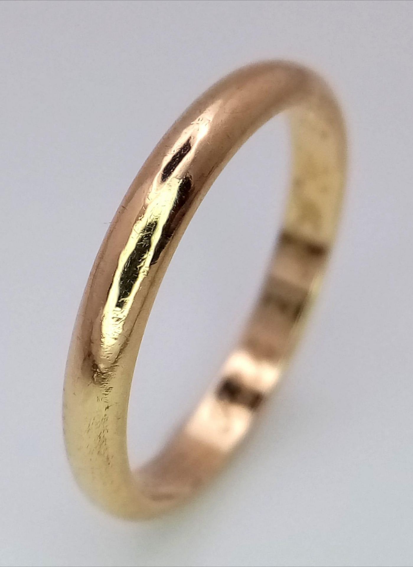 A CARTIER 18K GOLD BAND RING . 2.2gms size K
