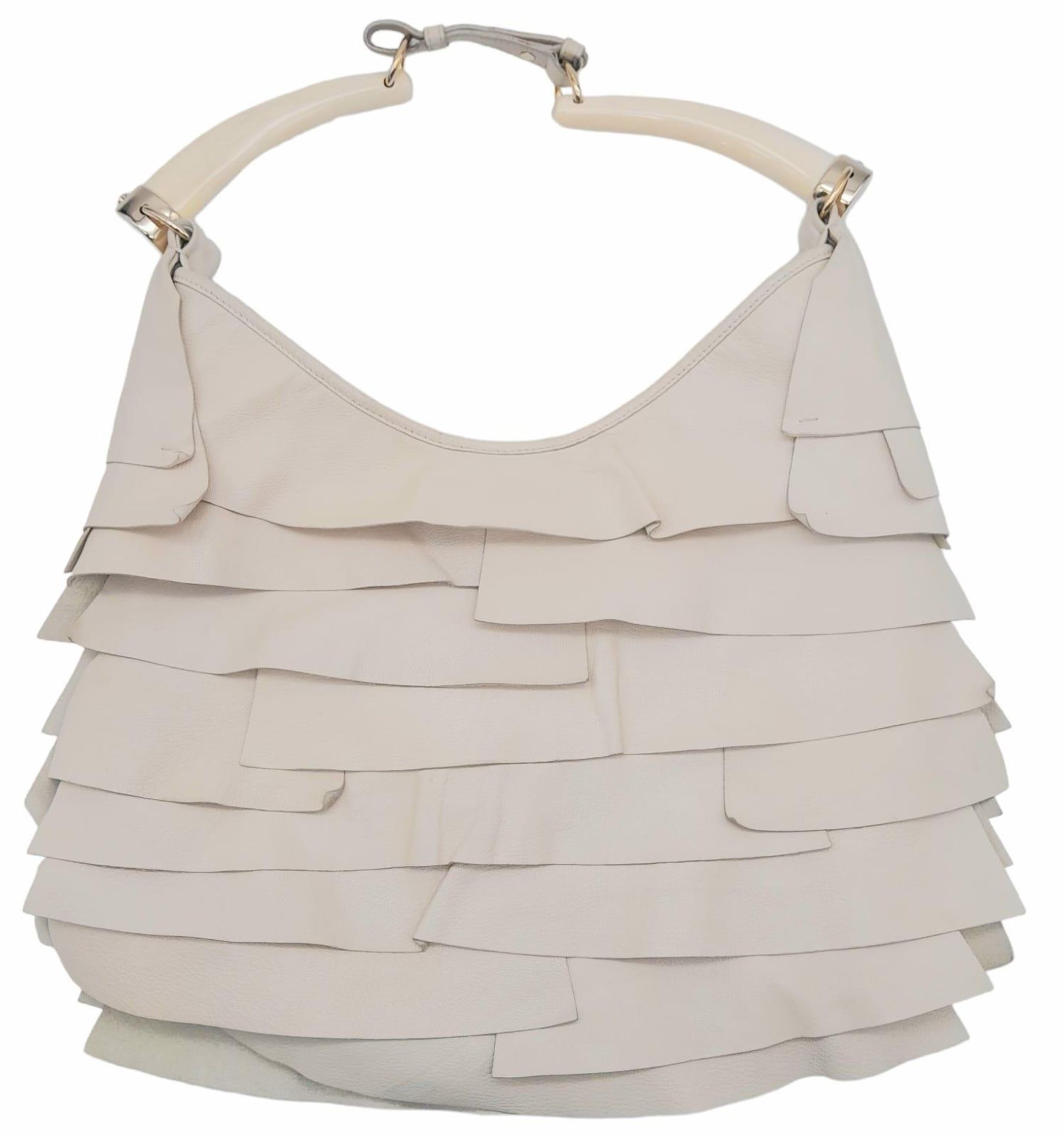 A YSL Saint-Tropez Leather Double Horn Hobo Bag. Ivory leather strip exterior. Horn shaped - Image 2 of 8
