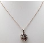 A vintage 925 silver locket pendant with floral design on silver curb chain. Total weight 4.3G.