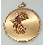 A SOLID 9K GOLD LOCKET STYLE PENDANT WITH GARNET DECORATION . 20.4gms 4.5cms DIAMETER 14954