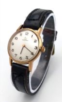 A Vintage 1960s 9K Gold Case Omega Watch. Black leather strap. 9k gold case - 24mm. White dial.