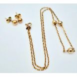 A very attractive, 9 K yellow gold chain necklace with golden balls and a pair of matching earrings.