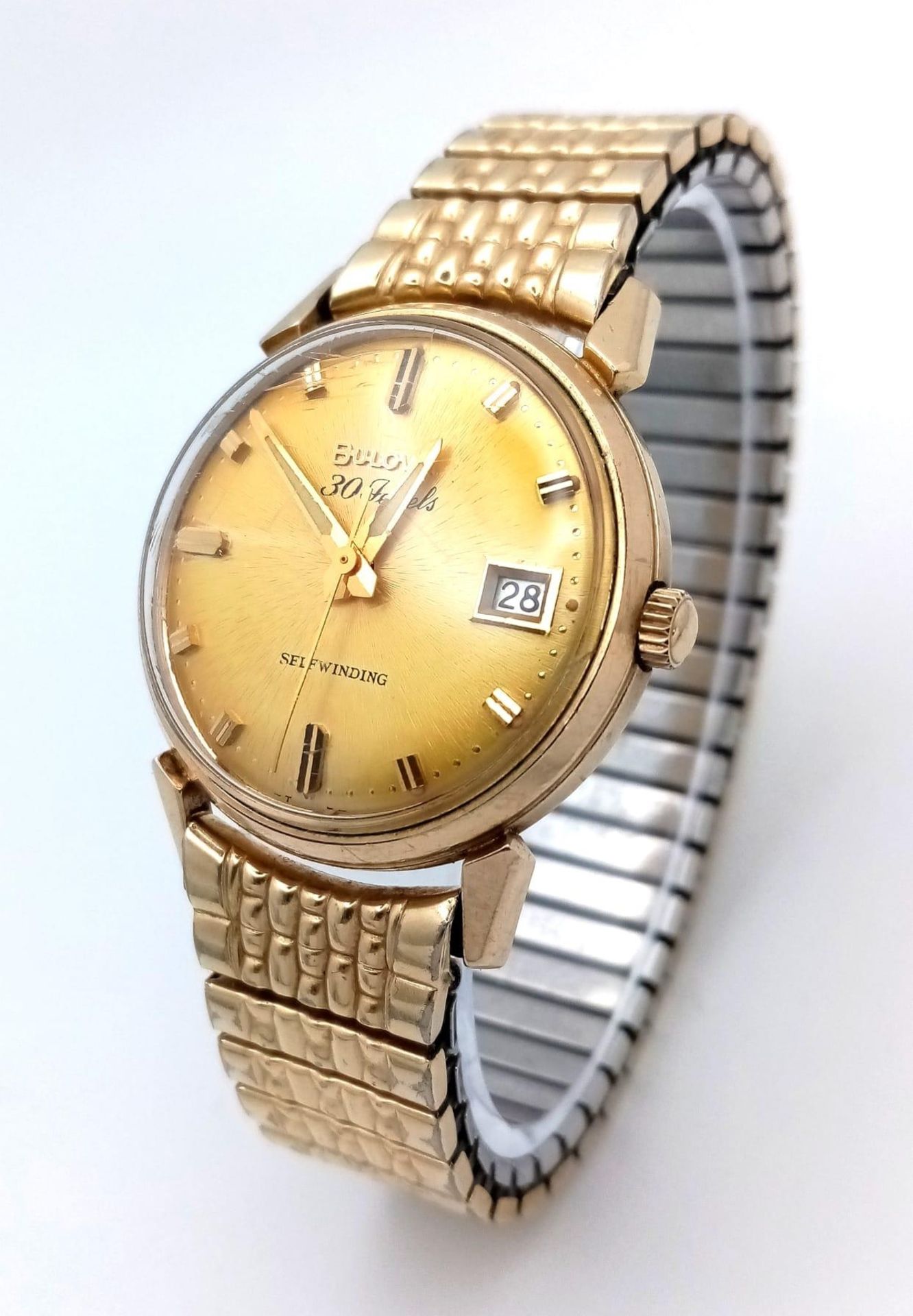 A Vintage 1960s Bulova Self-Winding Gents Watch. Gold plated expandable strap. Gold plated case -
