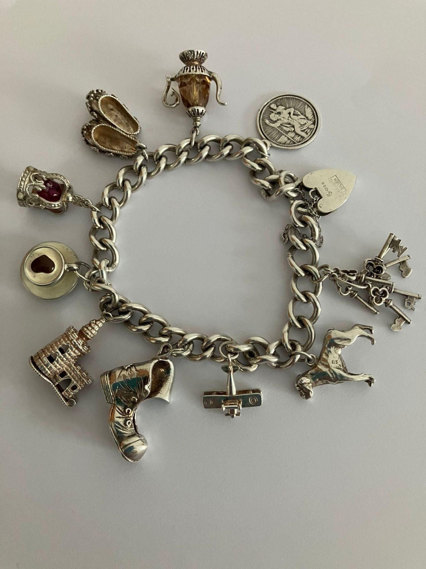 Vintage SILVER CHARM BRACELET, Silver Charms to include RAF biplane, Castle with turret, Saint