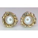 A fancy pair of 9CT gold pearl flower earrings. Total weight 2.12G.