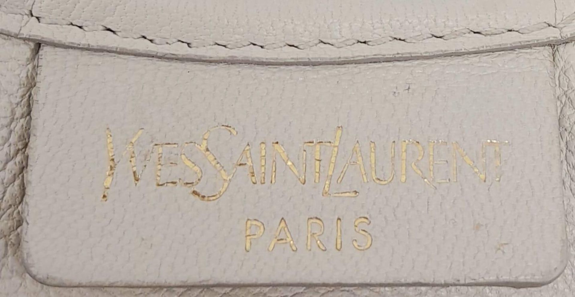 A YSL Saint-Tropez Leather Double Horn Hobo Bag. Ivory leather strip exterior. Horn shaped - Image 7 of 8