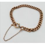 A vintage, 9 K rose gold chain bracelet with security chain. Clasp in good working order. Has had
