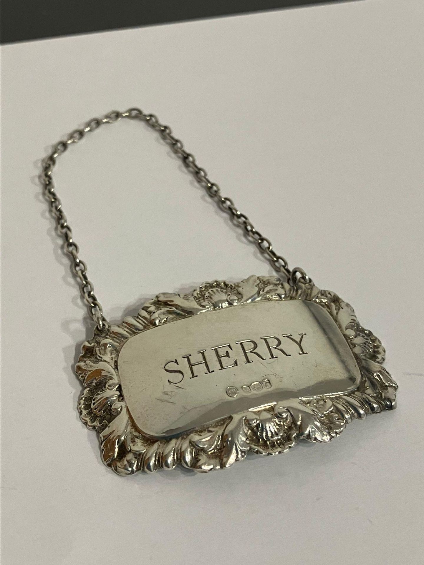 Vintage SHERRY SILVER DECANTER LABEL. Fully hallmarked. Having attractive leaf and Shell borders.