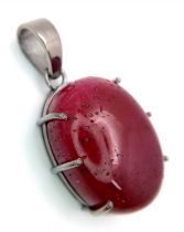 A Ruby Silver Pendant. Oval cut set in 925 Sterling silver. 57ctw. W-15.5g. 4cm. Ref: VO-1953. Comes
