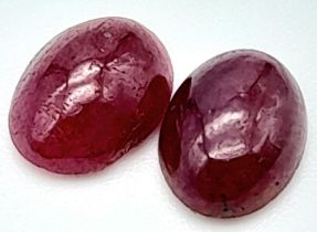 A PAIR OF MATCHING OVAL CABOCHON RUBIES. 3CT , 0.60g A/S 2005