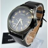 A Citizen Eco Drive Gents Watch. Brown leather strap. Brushed stainless steel case - 43mm. Black