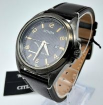 A Citizen Eco Drive Gents Watch. Brown leather strap. Brushed stainless steel case - 43mm. Black