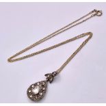 A 14K Yellow Gold Necklace with a Diamond Set Pendant. Pendant measures 2.5cm in length and features