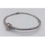 A PANDORA STERLING SILVER BRACELET. 14.8G