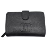 A Chanel Metallic Grey Leather Purse/Wallet. Textured leather exterior with embossed CC logo.