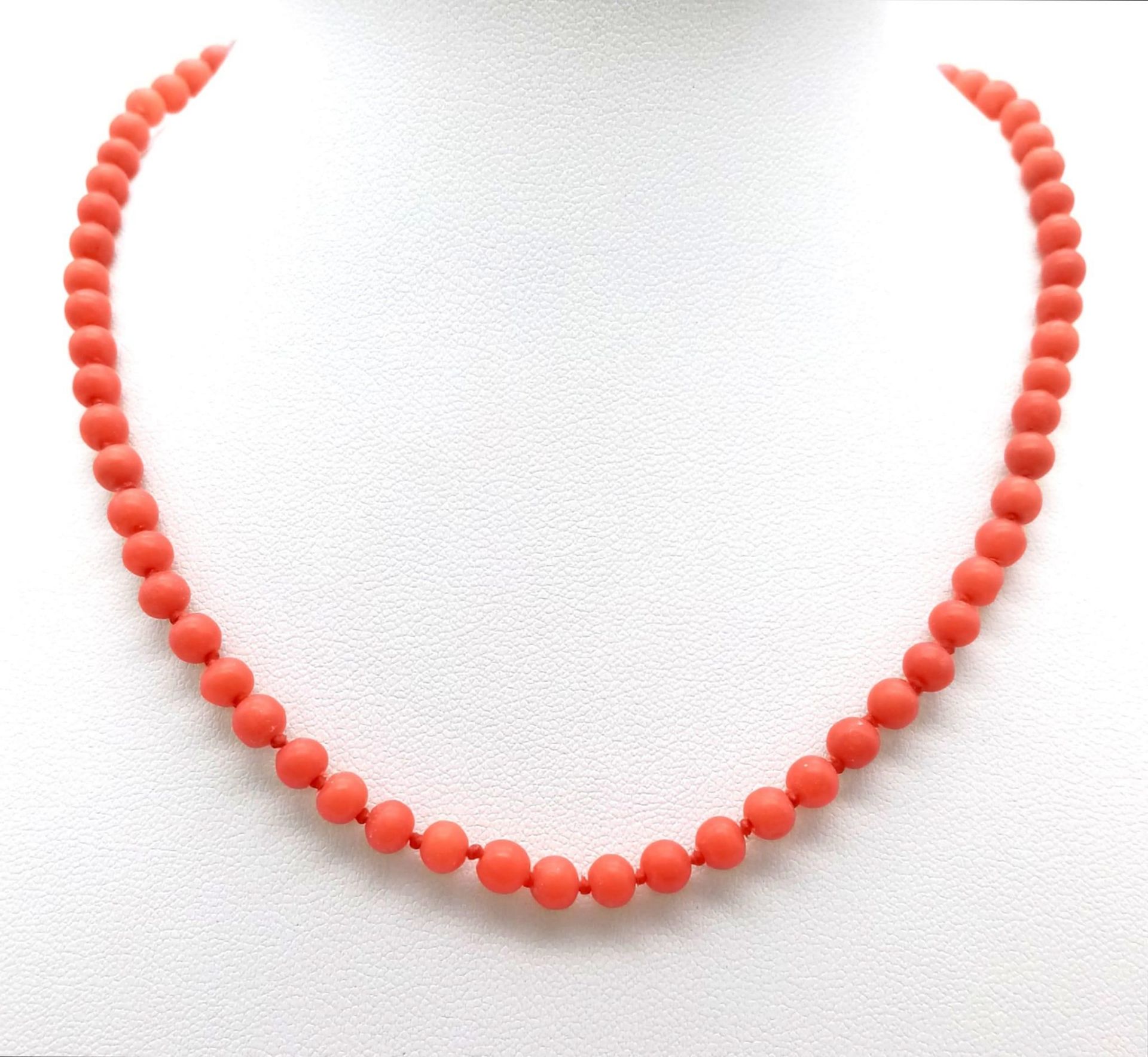 A vintage Orange Beaded Necklace. Measuring 38cms in length, this necklace is a great, bold addition