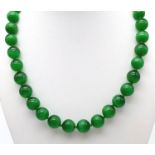 A Green Cat's Eye Beaded Necklace. 12mm beads. 42cm necklace length